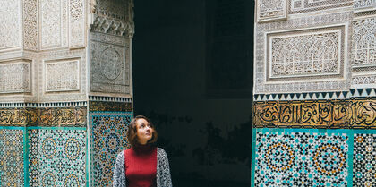 Girl standing in Moroccan tiled building